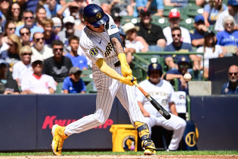 Aug 11, 2024; Milwaukee, Wisconsin, USA; Milwaukee Brewers third baseman Joseph Ortiz (3) hits a two-run home run in the second inning against the Cincinnati Reds at American Family Field. Mandatory Credit: Benny Sieu-USA TODAY Sports