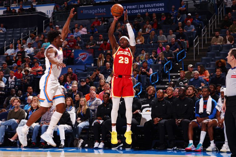 OKLAHOMA CITY, OK - OCTOBER 17: Daeqwon Plowden #29 of the Atlanta Hawks shoots a three point basket during the game against the Oklahoma City Thunder on October 17, 2024 at Paycom Arena in Oklahoma City, Oklahoma. NOTE TO USER: User expressly acknowledges and agrees that, by downloading and or using this photograph, User is consenting to the terms and conditions of the Getty Images License Agreement. Mandatory Copyright Notice: Copyright 2024 NBAE (Photo by Zach Beeker/NBAE via Getty Images)