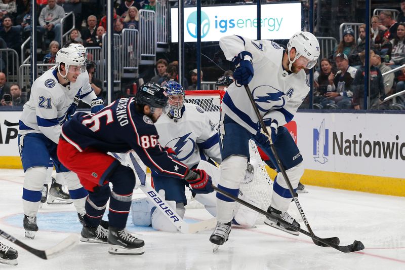 Feb 10, 2024; Columbus, Ohio, USA; Tampa Bay Lightning defenseman Victor Hedman (77) and Columbus Blue Jackets right wing Kirill Marchenko (86) battle for a loose puck during the second period at Nationwide Arena. Mandatory Credit: Russell LaBounty-USA TODAY Sports