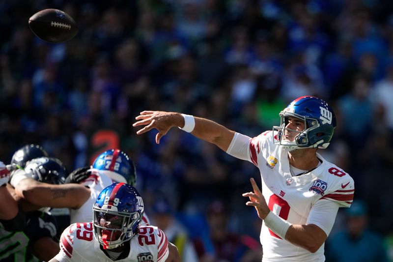 New York Giants quarterback Daniel Jones (8) passes during the first half of an NFL football game against the Seattle Seahawks, Sunday, Oct. 6, 2024, in Seattle. (AP Photo/Lindsey Wasson)