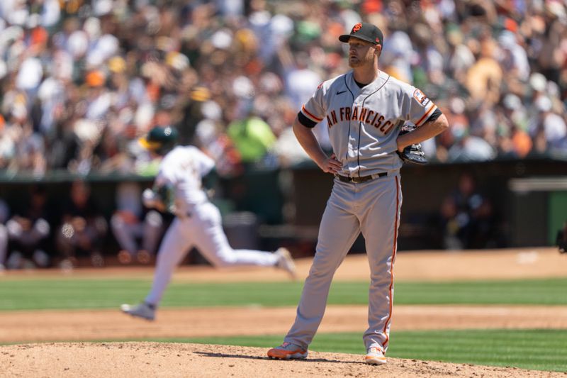 Aug 6, 2023; Oakland, California, USA;  San Francisco Giants starting pitcher Alex Cobb (38) reacts as Oakland Athletics shortstop Nick Allen (2) runs the bases after hitting a two-run home run during the second inning at Oakland-Alameda County Coliseum. Mandatory Credit: Stan Szeto-USA TODAY Sports