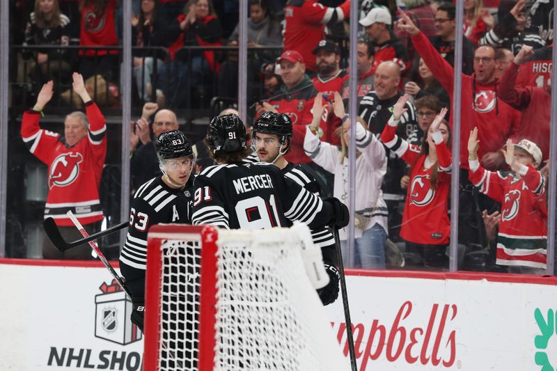 Nov 26, 2025; Newark, New Jersey, USA; New Jersey Devils center Nico Hischier (13) celebrates his goal against the St. Louis Blues during the second period at Prudential Center. Mandatory Credit: Ed Mulholland-Imagn Images