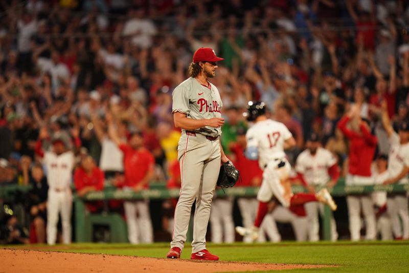 Jun 13, 2024; Boston, Massachusetts, USA; Boston Red Sox right fielder Tyler O'Neill (17) hits a three run home run against Philadelphia Phillies starting pitcher Aaron Nola (27) in the fourth inning at Fenway Park. Mandatory Credit: David Butler II-USA TODAY Sports