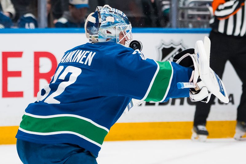 Mar 24, 2026; Vancouver, British Columbia, CAN; Vancouver Canucks goalie Kevin Lankinen (32) makes a save against the Anaheim Ducks in the first period at Rogers Arena. Mandatory Credit: Bob Frid-Imagn Images