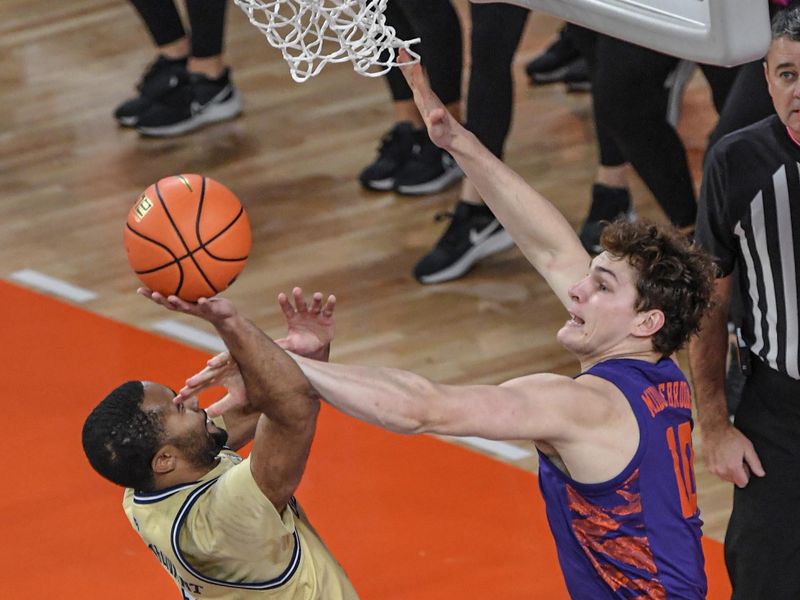 Jan 24, 2023; Clemson, South Carolina, USA; Georgia Tech Yellow Jackets forward Javon Franklin (4) shoots against Clemson Tigers forward Ben Middlebrooks (10) during the first half at Littlejohn Coliseum. Mandatory Credit: Ken Ruinard-USA TODAY Sports