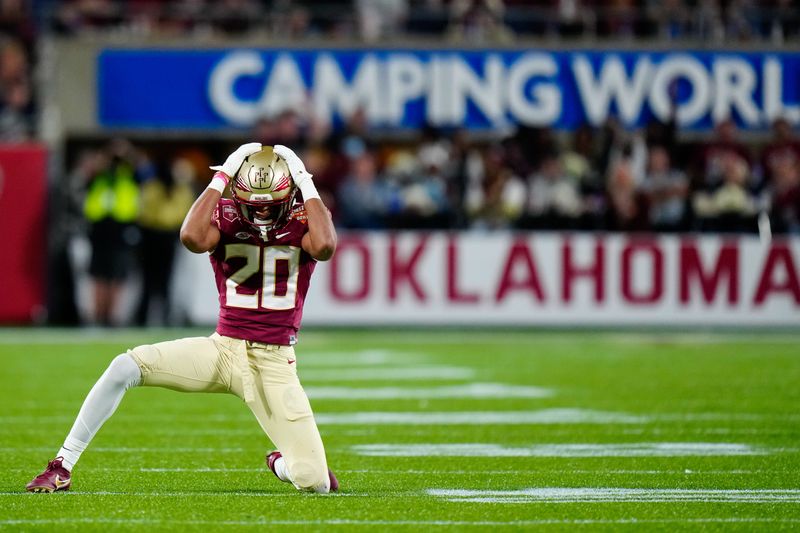 Dec 29, 2022; Orlando, Florida, USA; Florida State Seminoles defensive back Azareye'h Thomas (20) reacts to missing an interception against the Oklahoma Sooners during the second half in the 2022 Cheez-It Bowl at Camping World Stadium. Mandatory Credit: Rich Storry-USA TODAY Sports