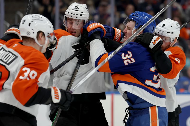 Jan 24, 2025; Elmont, New York, USA; New York Islanders center Kyle MacLean (32) fights against Philadelphia Flyers right wing Matvei Michkov (39) and defensemen Rasmus Ristolainen (55) and Cam York (8) during the second period at UBS Arena. Mandatory Credit: Brad Penner-Imagn Images