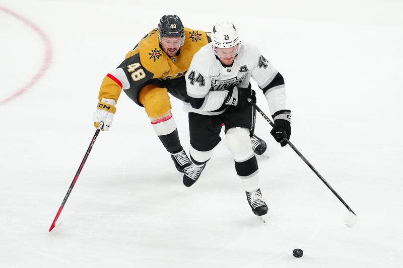 Oct 22, 2024; Las Vegas, Nevada, USA; Los Angeles Kings defenseman Mikey Anderson (44) skates ahead of Vegas Golden Knights center Tomas Hertl (48) during the third period at T-Mobile Arena. Mandatory Credit: Stephen R. Sylvanie-Imagn Images