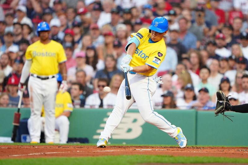 Jul 27, 2024; Boston, Massachusetts, USA; Boston Red Sox designated hitter Masataka Yoshida (7) hits a single against the New York Yankees during the first inning at Fenway Park. Mandatory Credit: Gregory Fisher-USA TODAY Sports