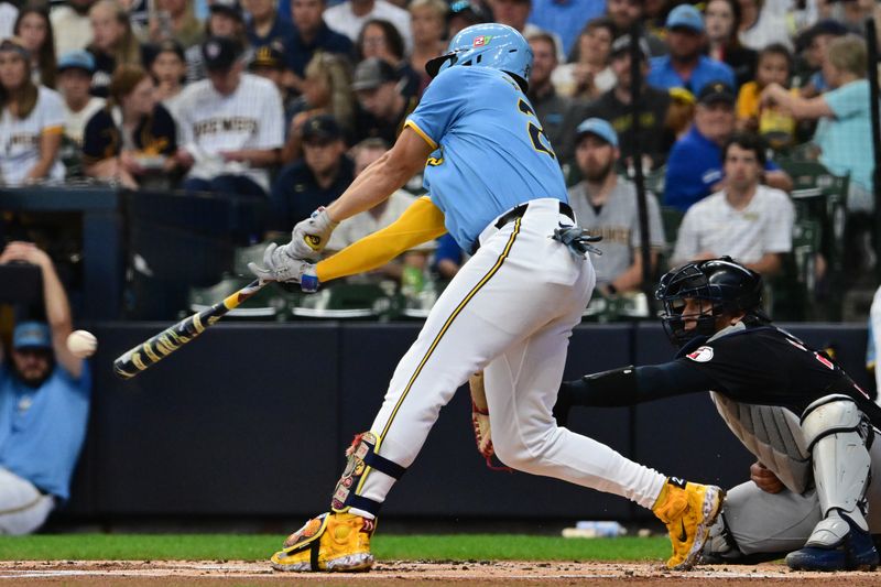 Aug 18, 2024; Milwaukee, Wisconsin, USA; Milwaukee Brewers shortstop Willy Adames (27) hits a single to drive in a run in the first inning against the Cleveland Guardians at American Family Field. Mandatory Credit: Benny Sieu-USA TODAY Sports