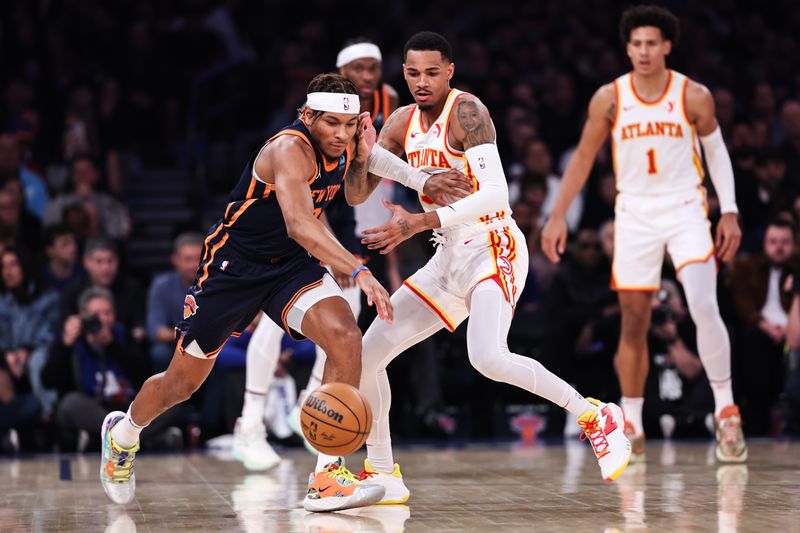 NEW YORK, NEW YORK - MARCH 05: Miles McBride #2 of the New York Knicks goes for a loose ball defended by Dejounte Murray #5 of the Atlanta Hawks during the first quarter of the game at Madison Square Garden on March 05, 2024 in New York City. NOTE TO USER: User expressly acknowledges and agrees that, by downloading and or using this photograph, User is consenting to the terms and conditions of the Getty Images License Agreement. (Photo by Dustin Satloff/Getty Images)