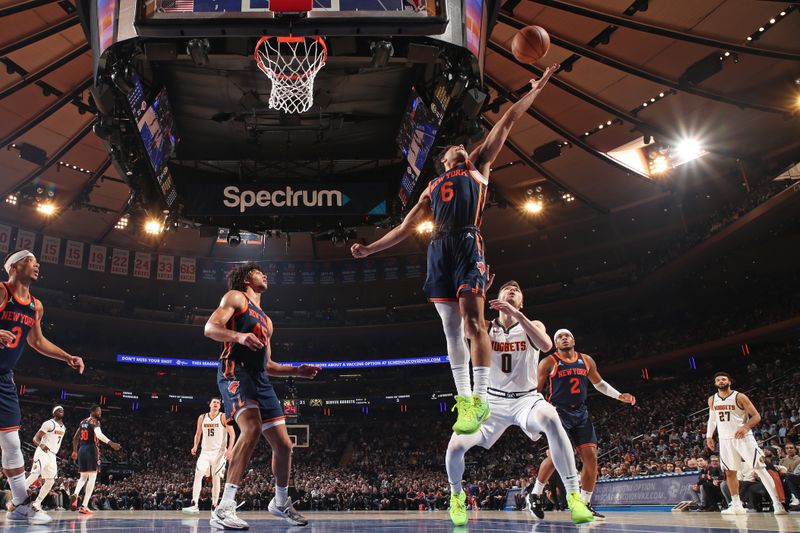 NEW YORK, NY - JANUARY 25: Quentin Grimes #6 of the New York Knicks rebounds during the game against the Denver Nuggets on January 25, 2024 at Madison Square Garden in New York City, New York.  NOTE TO USER: User expressly acknowledges and agrees that, by downloading and or using this photograph, User is consenting to the terms and conditions of the Getty Images License Agreement. Mandatory Copyright Notice: Copyright 2024 NBAE  (Photo by Nathaniel S. Butler/NBAE via Getty Images)