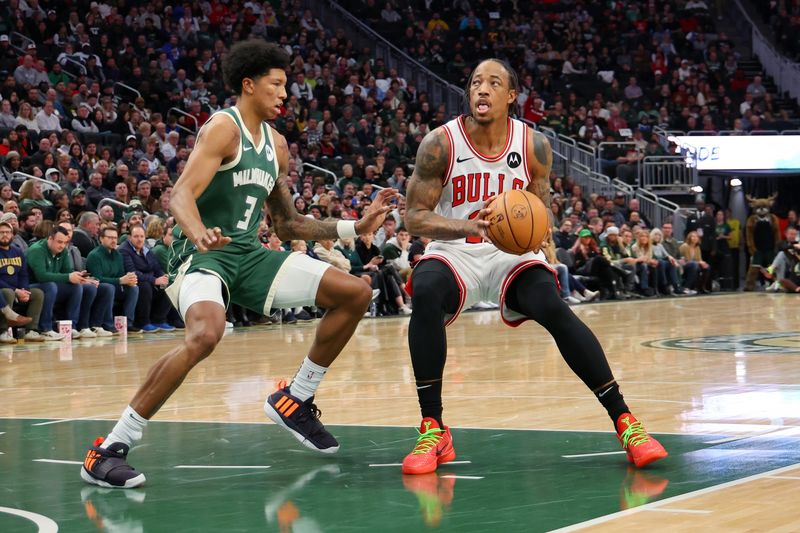 MILWAUKEE, WISCONSIN - DECEMBER 11: DeMar DeRozan #11 of the Chicago Bulls is defended by MarJon Beauchamp #3 of the Milwaukee Bucks during a game at Fiserv Forum on December 11, 2023 in Milwaukee, Wisconsin. NOTE TO USER: User expressly acknowledges and agrees that, by downloading and or using this photograph, User is consenting to the terms and conditions of the Getty Images License Agreement. (Photo by Stacy Revere/Getty Images)