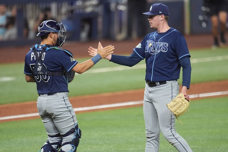 Aug 30, 2023; Miami, Florida, USA; Tampa Bay Rays relief pitcher Pete Fairbanks, right, celebrates with catcher Rene Pinto (50) after their victory over the Miami Marlins at loanDepot Park. Mandatory Credit: Jim Rassol-USA TODAY Sports