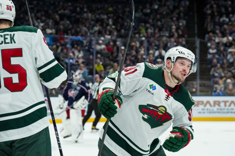 Dec 18, 2025; Columbus, Ohio, USA;  Minnesota Wild right wing Vladimir Tarasenko (91) celebrates with teammates after scoring a goal against Columbus Blue Jackets in the second period at Nationwide Arena. Mandatory Credit: Aaron Doster-Imagn Images
