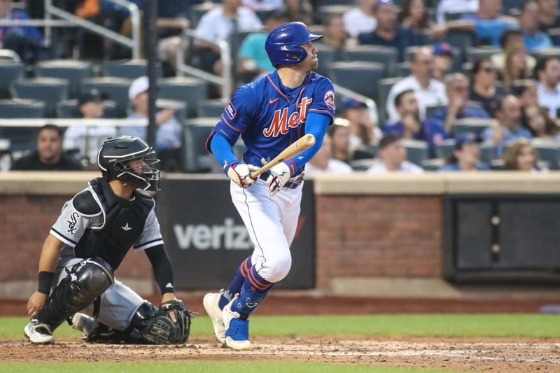 Jul 19, 2023; New York City, New York, USA;  New York Mets center fielder Brandon Nimmo (9) hits an RBI double in the fourth inning against the Chicago White Sox at Citi Field. Mandatory Credit: Wendell Cruz-USA TODAY Sports