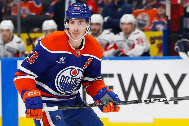 Jan 21, 2025; Edmonton, Alberta, CAN; Edmonton Oilers forward Ryan Nugent-Hopkins (93) looks for a loose puck against the Edmonton Oilers at Rogers Place. Mandatory Credit: Perry Nelson-Imagn Images