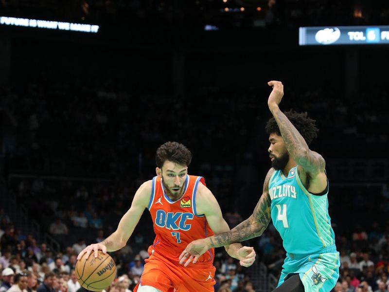 CHARLOTTE, NC - APRIL 7: Chet Holmgren #7 of the Oklahoma City Thunder dribbles the ball during the game against the Charlotte Hornets on April 7, 2024 at Spectrum Center in Charlotte, North Carolina. NOTE TO USER: User expressly acknowledges and agrees that, by downloading and or using this photograph, User is consenting to the terms and conditions of the Getty Images License Agreement.  Mandatory Copyright Notice:  Copyright 2024 NBAE (Photo by Brock Williams-Smith/NBAE via Getty Images)