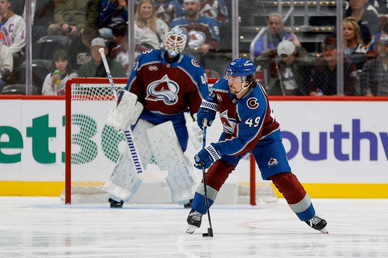 Oct 14, 2024; Denver, Colorado, USA; Colorado Avalanche defenseman Samuel Girard (49) controls the puck in the second period against the New York Islanders at Ball Arena. Mandatory Credit: Isaiah J. Downing-Imagn Images