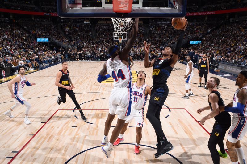 DENVER, CO - JANUARY 27: Peyton Watson #8 of the Denver Nuggets drives to the basket during the game against the Philadelphia 76ers on January 27, 2024 at the Ball Arena in Denver, Colorado. NOTE TO USER: User expressly acknowledges and agrees that, by downloading and/or using this Photograph, user is consenting to the terms and conditions of the Getty Images License Agreement. Mandatory Copyright Notice: Copyright 2024 NBAE (Photo by Garrett Ellwood/NBAE via Getty Images)