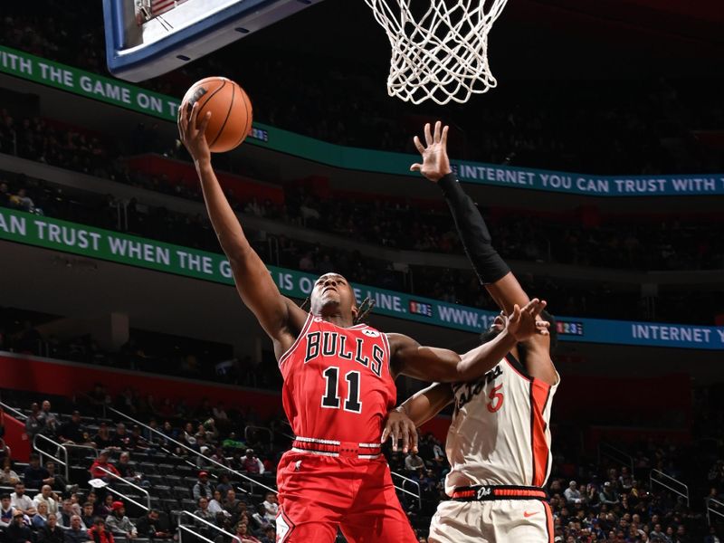 DETROIT, MI - NOVEMBER 18: Ayo Dosunmu #11 of the Chicago Bulls drives to the basket during the game against the Detroit Pistons on November 18, 2024 at Little Caesars Arena in Detroit, Michigan. NOTE TO USER: User expressly acknowledges and agrees that, by downloading and/or using this photograph, User is consenting to the terms and conditions of the Getty Images License Agreement. Mandatory Copyright Notice: Copyright 2024 NBAE (Photo by Chris Schwegler/NBAE via Getty Images)