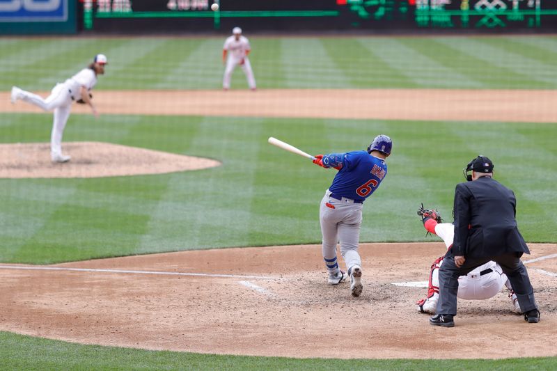 May 4, 2023; Washington, District of Columbia, USA; Chicago Cubs catcher Miguel Amaya (6) hits a sacrifice fly RBI against the Washington Nationals during the eighth inning at Nationals Park. Mandatory Credit: Geoff Burke-USA TODAY Sports