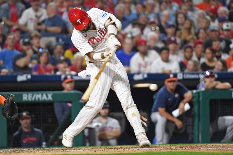 Aug 26, 2024; Philadelphia, Pennsylvania, USA; Philadelphia Phillies outfielder Nick Castellanos (8) hits an RBI single against the Houston Astros during the sixth inning at Citizens Bank Park. Mandatory Credit: Eric Hartline-USA TODAY Sports