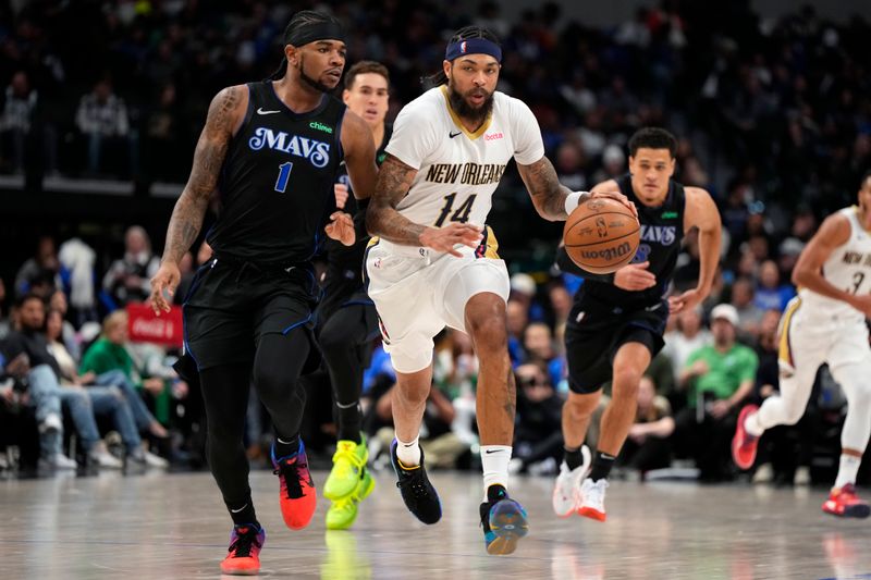 DALLAS, TEXAS - JANUARY 15: Brandon Ingram #14 of the New Orleans Pelicans brings the ball up court as Jaden Hardy #1 of the Dallas Mavericks defends during the second half at American Airlines Center on January 15, 2024 in Dallas, Texas. NOTE TO USER: User expressly acknowledges and agrees that, by downloading and or using this photograph, User is consenting to the terms and conditions of the Getty Images License Agreement. (Photo by Sam Hodde/Getty Images)