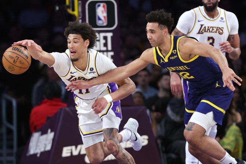 LOS ANGELES, CALIFORNIA - MARCH 16: Jaxson Hayes #11 of the Los Angeles Lakers battles Trayce Jackson-Davis #32 of the Golden State Warriors for a loose ball during the first half of a game at Crypto.com Arena on March 16, 2024 in Los Angeles, California. NOTE TO USER: User expressly acknowledges and agrees that, by downloading and or using this photograph, User is consenting to the terms and conditions of the Getty Images License Agreement. (Photo by Sean M. Haffey/Getty Images)