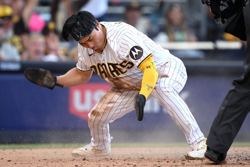 Jun 15, 2023; San Diego, California, USA; San Diego Padres second baseman Ha-seong Kim (7) celebrates after scoring a run against the Cleveland Guardians during the third inning at Petco Park. Mandatory Credit: Orlando Ramirez-USA TODAY Sports