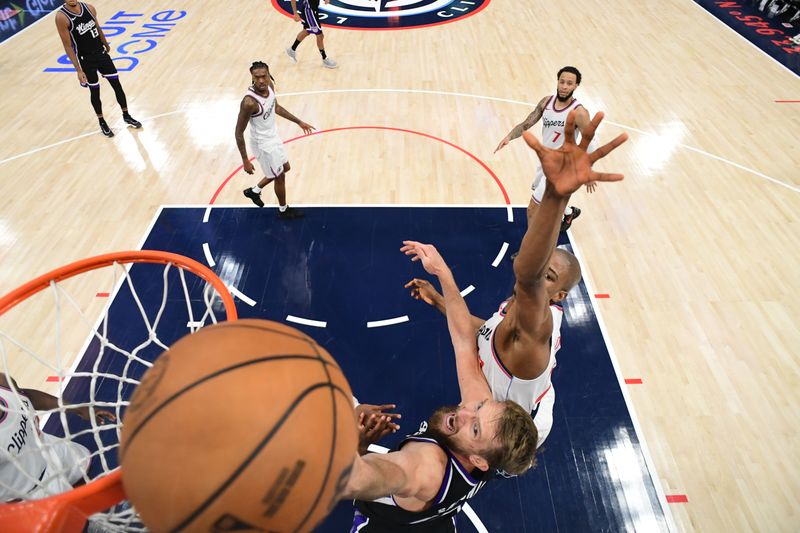 INGLEWOOD, CA - OCTOBER 17: Domantas Sabonis #11 of the Sacramento Kings drives to the basket during the game against the LA Clippers during a NBA Preseason game on October 17, 2024 at Intuit Dome in Los Angeles, California. NOTE TO USER: User expressly acknowledges and agrees that, by downloading and/or using this Photograph, user is consenting to the terms and conditions of the Getty Images License Agreement. Mandatory Copyright Notice: Copyright 2024 NBAE (Photo by Adam Pantozzi/NBAE via Getty Images)