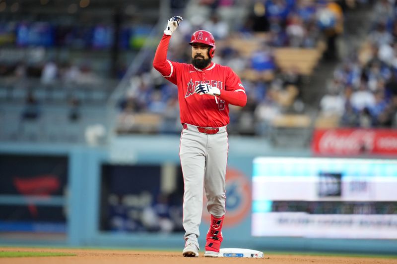 Mar 25, 2024; Los Angeles, California, USA; Los Angeles Angels designated hitter Anthony Rendon (6) gestures after hitting a double in the third inning against the Los Angeles Dodgers at Dodger Stadium. Mandatory Credit: Kirby Lee-USA TODAY Sports