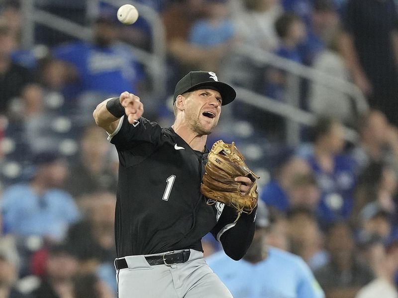 May 22, 2024; Toronto, Ontario, CAN; Chicago White Sox third baseman Zach Remillard (1) throws to first base on a ground ball by Toronto Blue Jays third baseman Isiah Kiner-Falefa (not pictured) during the seventh inning at Rogers Centre. Mandatory Credit: John E. Sokolowski-USA TODAY Sports