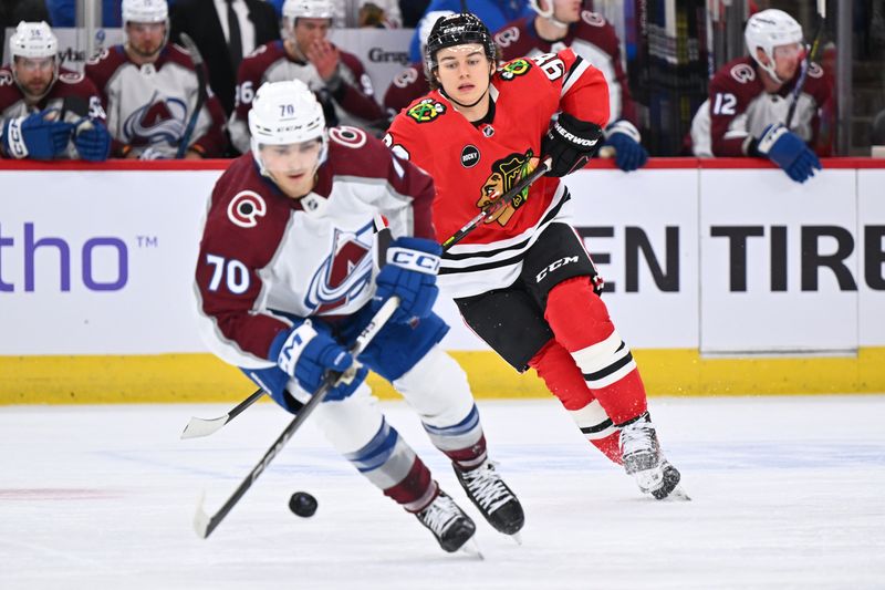 Dec 19, 2023; Chicago, Illinois, USA; Chicago Blackhawks forward Connor Bedard (98) chases after the puck and Colorado Avalanche defenseman Sam Malinski (70) in the first period at United Center. Mandatory Credit: Jamie Sabau-USA TODAY Sports