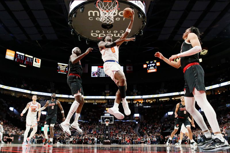 PORTLAND, OREGON - MARCH 14: OG Anunoby #8 of the New York Knicks shoots the ball past Duop Reath #26 of the Portland Trail Blazers during the second half at Moda Center on March 14, 2024 in Portland, Oregon. NOTE TO USER: User expressly acknowledges and agrees that, by downloading and or using this photograph, User is consenting to the terms and conditions of the Getty Images License Agreement.  (Photo by Soobum Im/Getty Images)