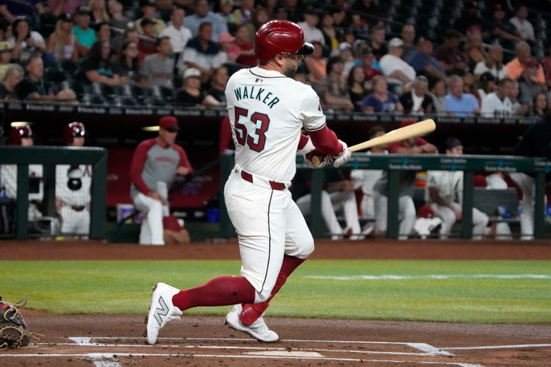 May 24, 2024; Phoenix, Arizona, USA; Arizona Diamondbacks first base Christian Walker (53) hits a single against the Miami Marlins in the first inning at Chase Field. Mandatory Credit: Rick Scuteri-USA TODAY Sports