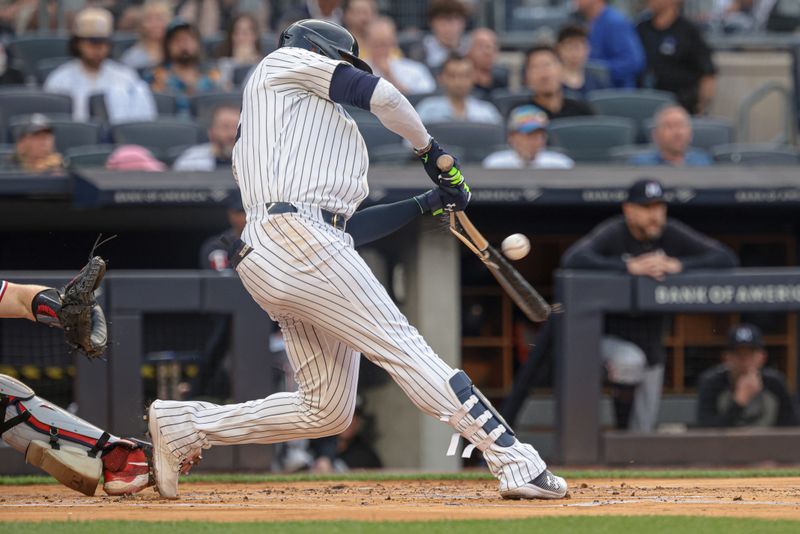 Jun 5, 2024; Bronx, New York, USA; New York Yankees right fielder Juan Soto (22) hits a broken bat single during the first inning against the Minnesota Twins at Yankee Stadium. Mandatory Credit: Vincent Carchietta-USA TODAY Sports