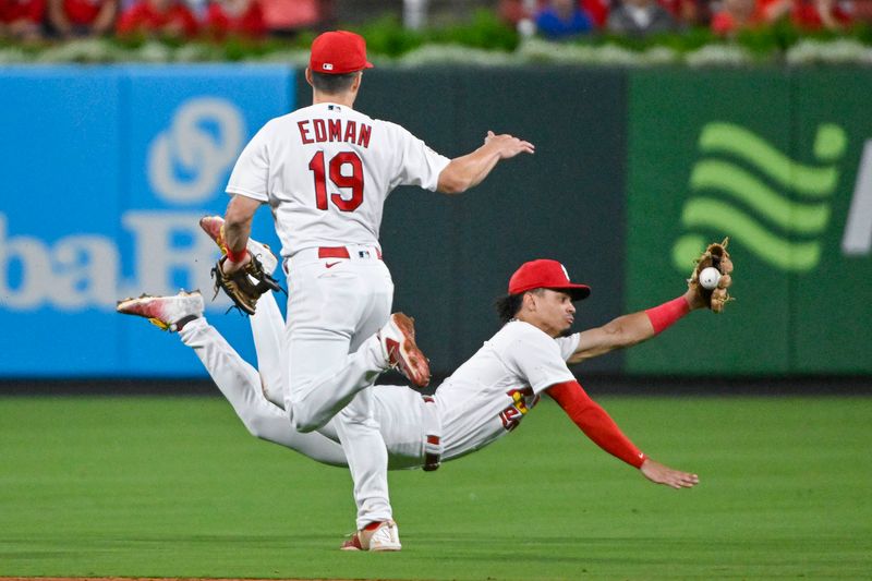 Sep 18, 2023; St. Louis, Missouri, USA;  St. Louis Cardinals shortstop Masyn Winn (0) dives but is unable to catch a fly ball hit by Milwaukee Brewers center fielder Sal Frelick (not pictured) during the eighth inning at Busch Stadium. Mandatory Credit: Jeff Curry-USA TODAY Sports