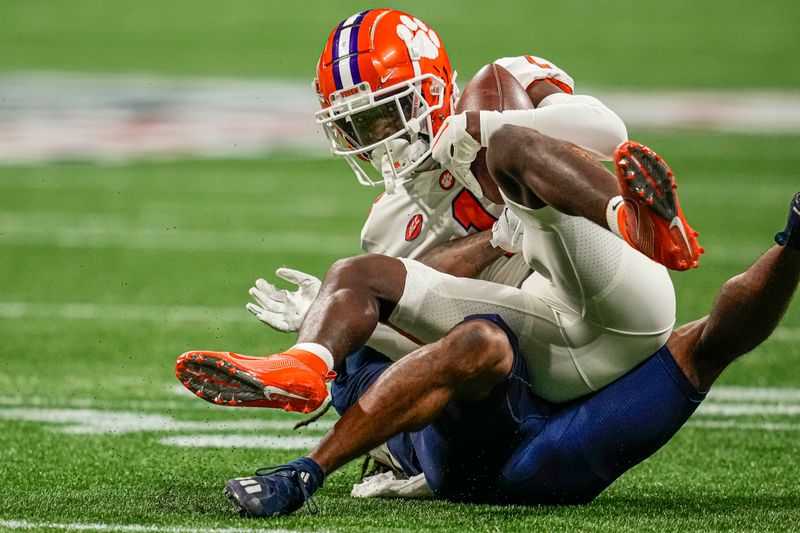 Sep 5, 2022; Atlanta, Georgia, USA; Clemson Tigers safety Andrew Mukuba (1) intercepts a pass over Georgia Tech Yellow Jackets wide receiver Nate McCollum (8) during the first quarter at Mercedes-Benz Stadium. Mandatory Credit: Dale Zanine-USA TODAY Sports