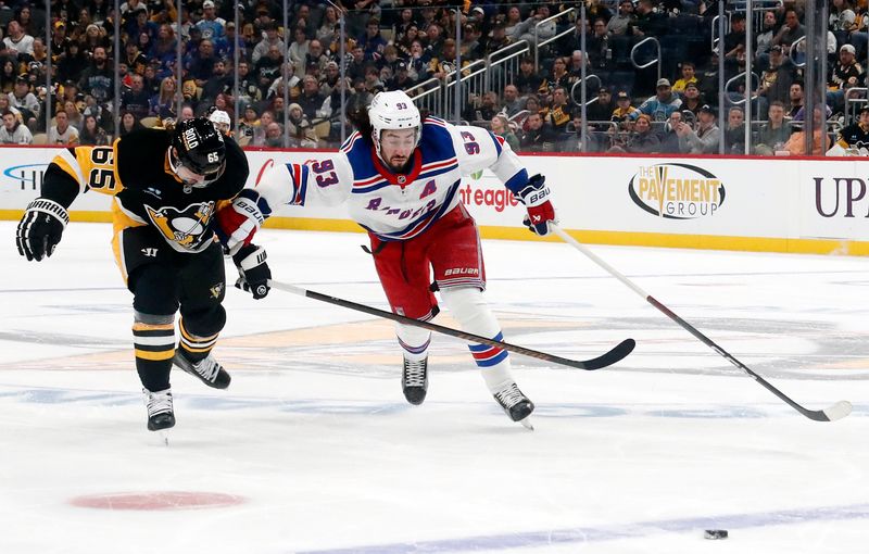 Oct 9, 2024; Pittsburgh, Pennsylvania, USA;  Pittsburgh Penguins defenseman Erik Karlsson (65) and New York Rangers center Mika Zibanejad (93) chase a loose puck during the second period at PPG Paints Arena. Mandatory Credit: Charles LeClaire-Imagn Images