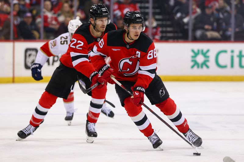 Jan 14, 2025; Newark, New Jersey, USA; New Jersey Devils center Jack Hughes (86) skates with the puck against the Florida Panthers during the second period at Prudential Center. Mandatory Credit: Ed Mulholland-Imagn Images