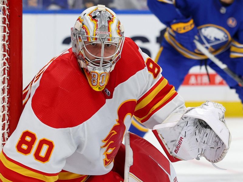 Oct 19, 2023; Buffalo, New York, USA;  Calgary Flames goaltender Dan Vladar (80) looks for the puck during the second period against the Buffalo Sabres at KeyBank Center. Mandatory Credit: Timothy T. Ludwig-USA TODAY Sports