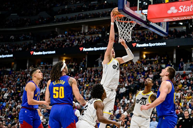 DENVER, COLORADO - MARCH 9: Walker Kessler #24 of the Utah Jazz scores in the second half of a game against the Denver Nuggets at Ball Arena on March 9, 2024 in Denver, Colorado. (Photo by Dustin Bradford/Getty Images)