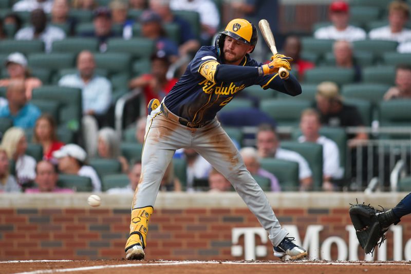 Aug 6, 2024; Atlanta, Georgia, USA; Milwaukee Brewers second baseman Brice Turang (2) gets out of the way of a pitch against the Atlanta Braves in the second inning at Truist Park. Mandatory Credit: Brett Davis-USA TODAY Sports