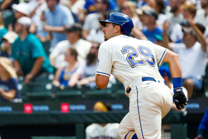 Jul 16, 2023; Seattle, Washington, USA; Seattle Mariners catcher Cal Raleigh (29) watches a solo-home run against the Detroit Tigers during the fourth inning at T-Mobile Park. Mandatory Credit: Joe Nicholson-USA TODAY Sports