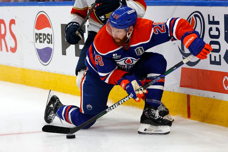 Jun 6, 2025; Edmonton, Alberta, CAN; Edmonton Oilers right wing Connor Brown (28) skates with the puck against the Florida Panthers during double overtime in game two of the 2025 Stanley Cup Final at Rogers Place. Mandatory Credit: Perry Nelson-Imagn Images