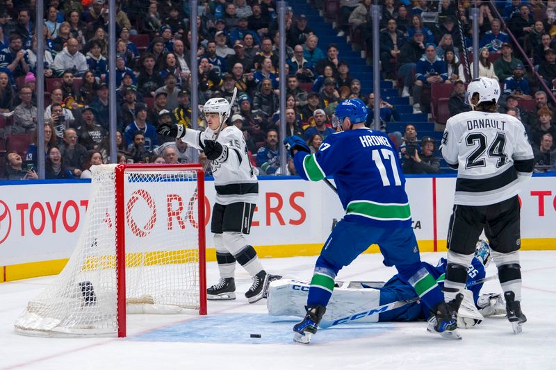 Jan 16, 2025; Vancouver, British Columbia, CAN; Vancouver Canucks defenseman Filip Hronek (17) and Los Angeles Kings forward Phillip Danault (24) watch as forward Alex Turcotte (15) celebrates his goal scored on goalie Thatcher Demko (35) in the first period at Rogers Arena. Mandatory Credit: Bob Frid-Imagn Images