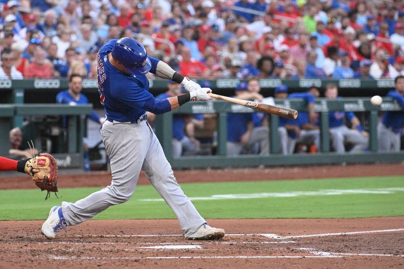 Jul 27, 2023; St. Louis, Missouri, USA; Chicago Cubs catcher Yan Gomes (15) hits an RBI single against the St. Louis Cardinals in the third inning at Busch Stadium. Mandatory Credit: Joe Puetz-USA TODAY Sports