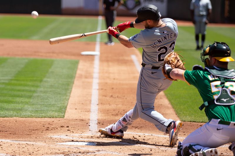 Aug 7, 2024; Oakland, California, USA; Chicago White Sox left fielder Andrew Benintendi (23) hits a two-run home run against the Oakland Athletics during the second inning at Oakland-Alameda County Coliseum. Mandatory Credit: D. Ross Cameron-USA TODAY Sports