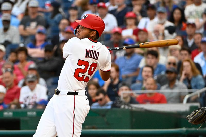 Aug 21, 2025; Washington, District of Columbia, USA; Washington Nationals designated hits a three run home run against the New York Mets during the eighth inning James Wood (29) hit at Nationals Park. Mandatory Credit: Brad Mills-Imagn Images